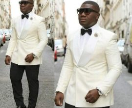 white suit black trousers